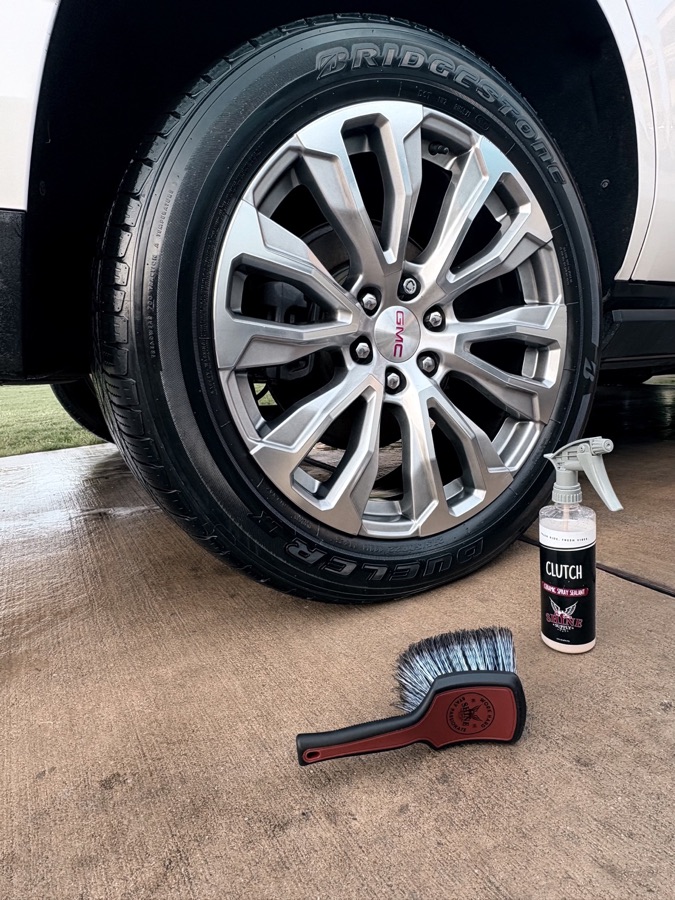 GMC truck wheel and tire cleaned and dressed with ceramic spray sealant