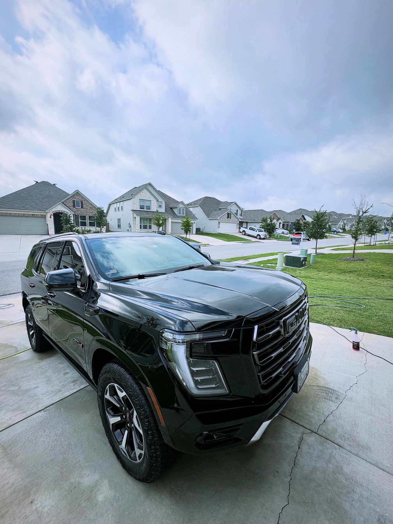 Glossy black GMC Yukon after a mobile detail